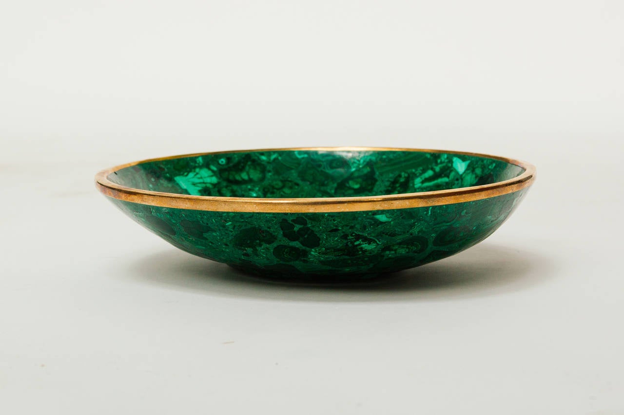 Malachite bowl with bronze rim.