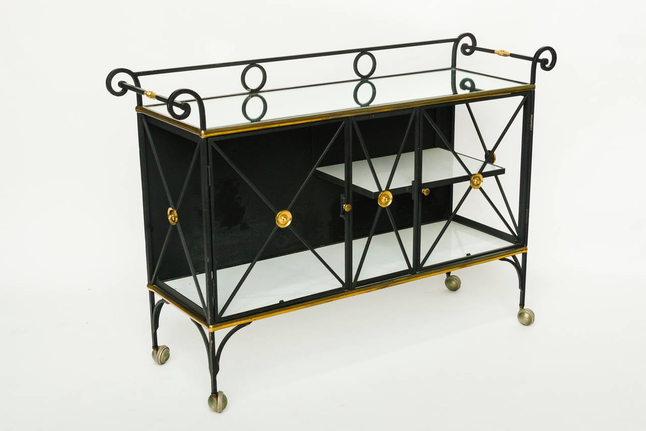 Iron Directoire Serving Cart with Brass Accents. Originally had curtains hanging but looks better bare. Mirrored top, milk glass shelves.