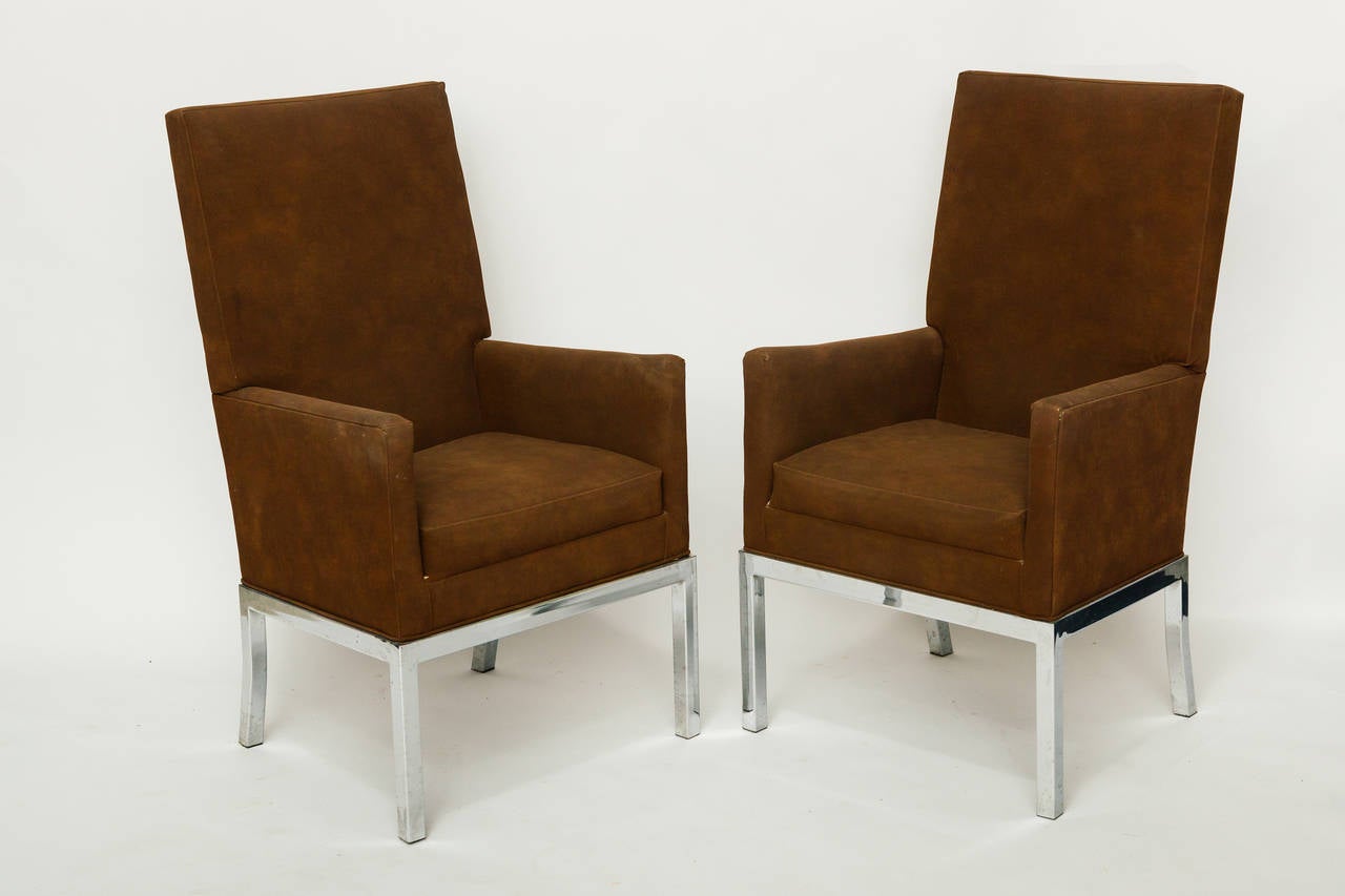 Pair of 1970's high back chairs with steel bases and original fabric.