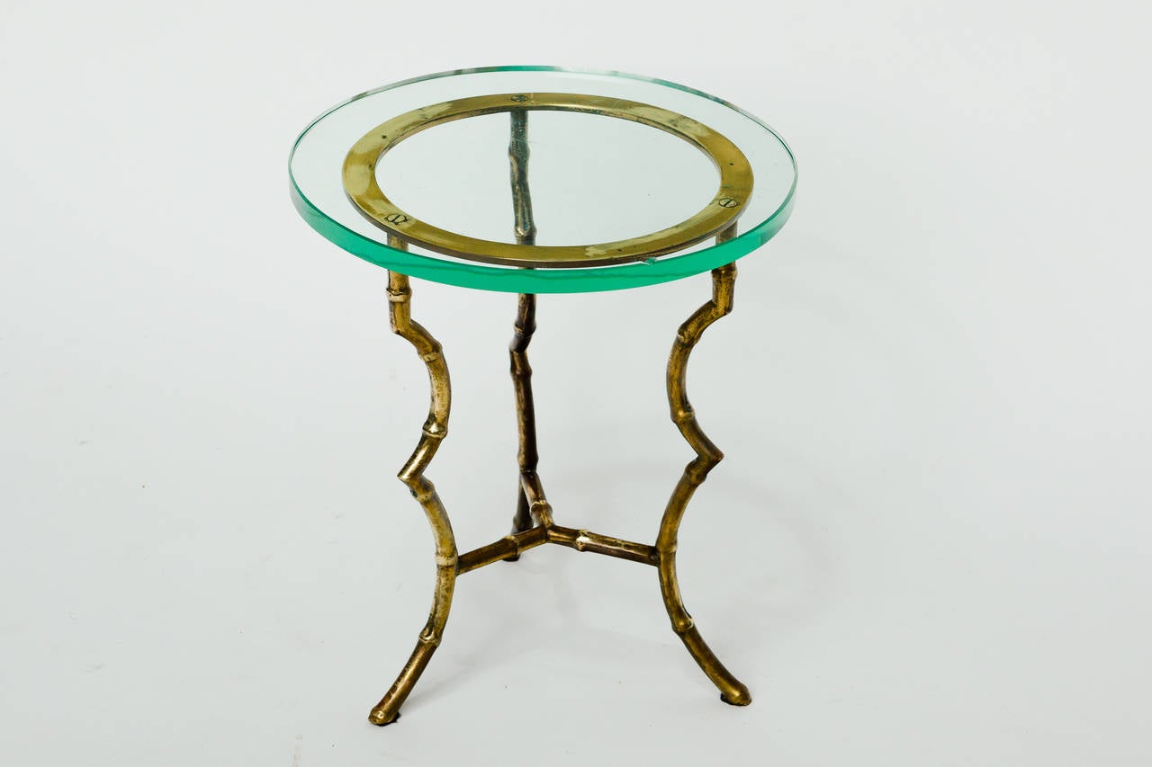 Faux bamboo rams hoof brass and glass side table. Chip in glass.

Diameter is of the glass.