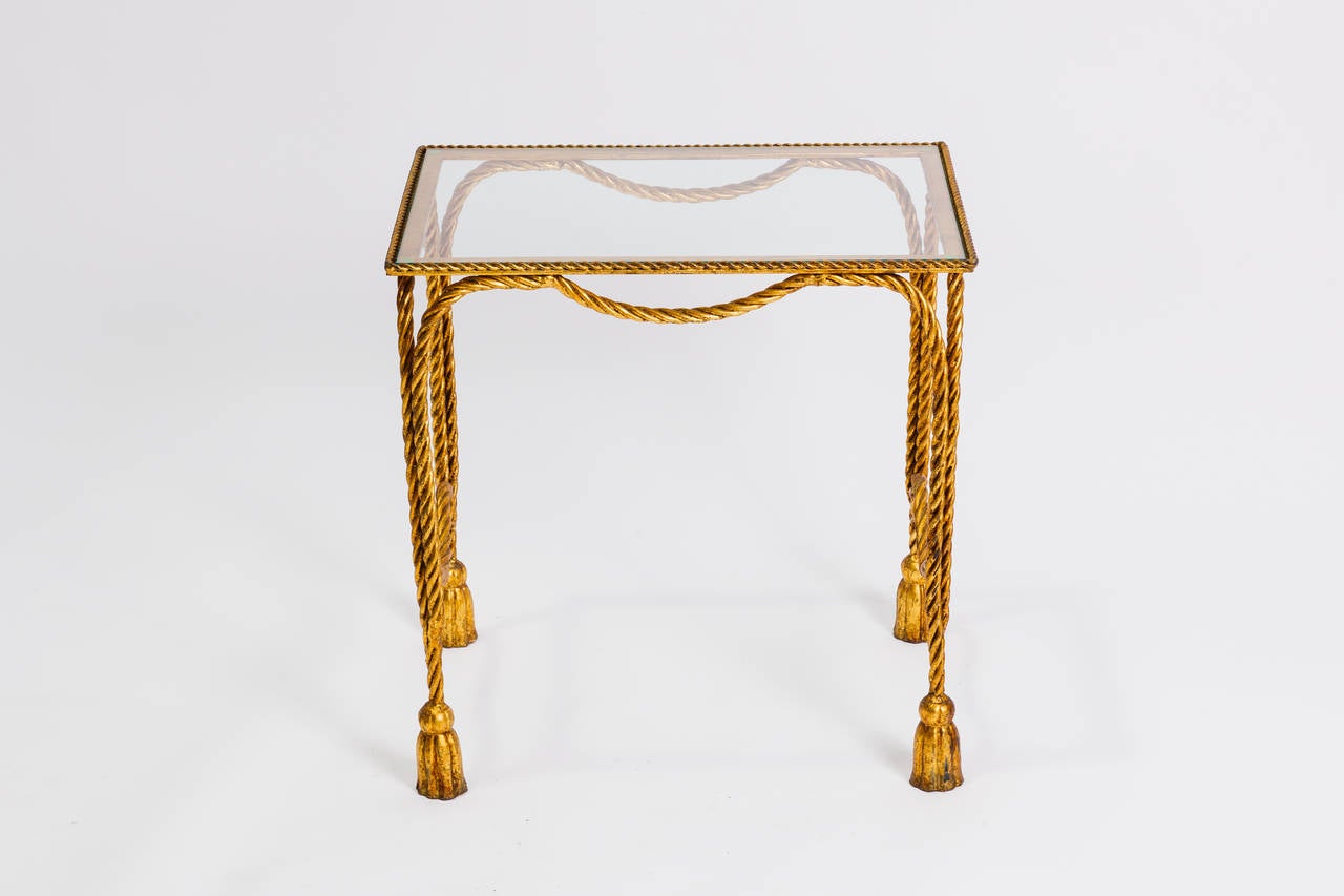 Italian gilt iron rope and tassel table.