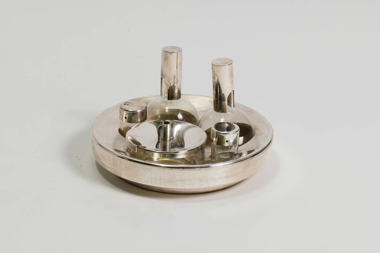 Silver plate salt and pepper, oil and vinegar, and relish dish.
