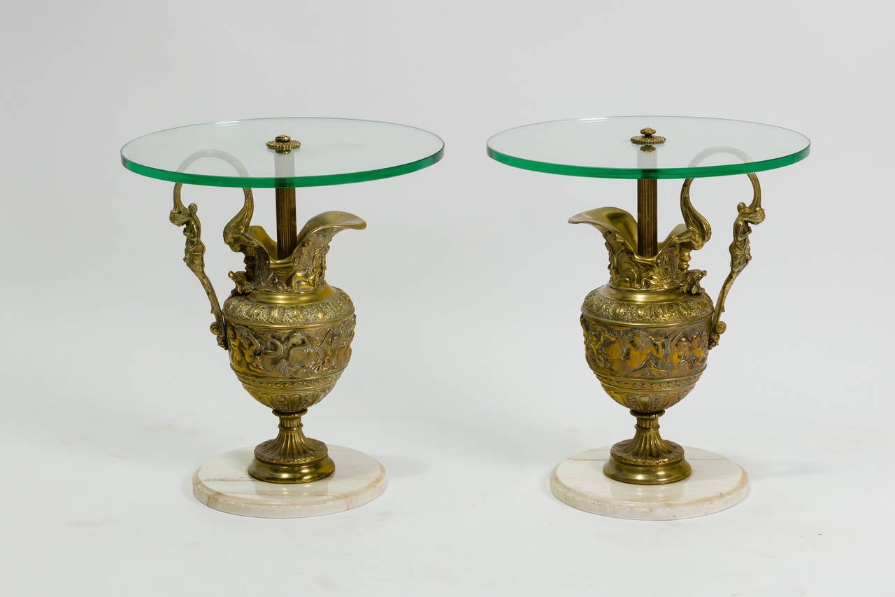 Pair of classical bronze urn side tables with glass tops and marble bases.