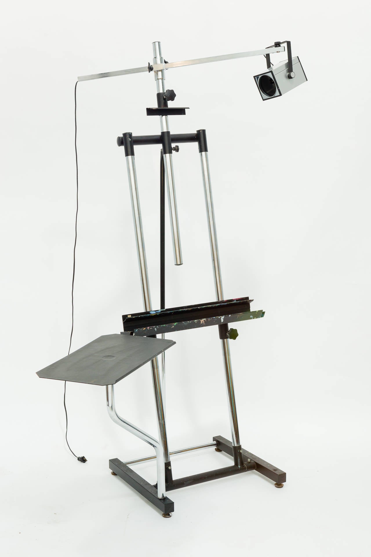 Mid century artist easel with a overhead lamp. Made in Italy in the 1970's. The easel is fully adjustable.
