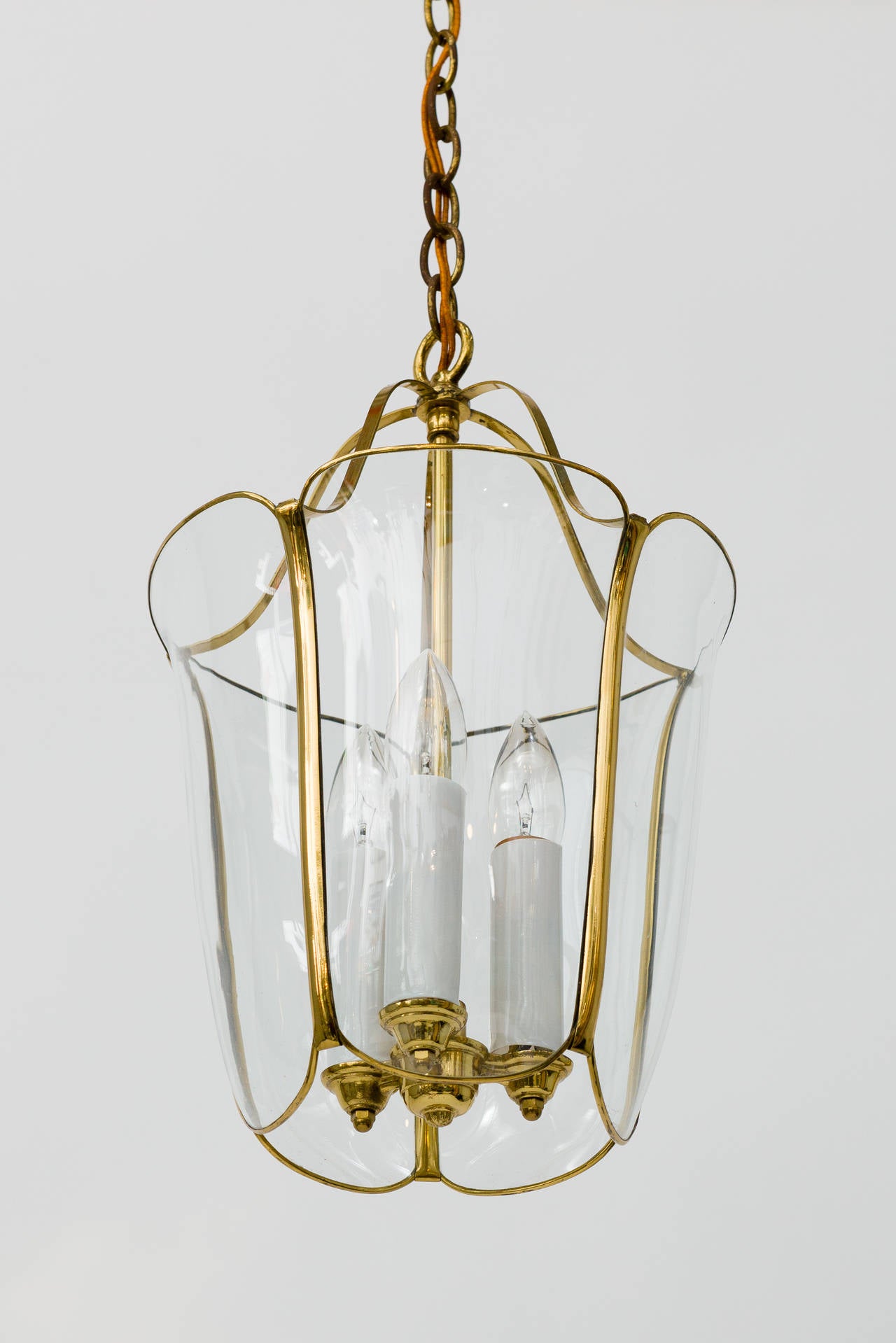 Brass and glass tulip pendant light fixture.