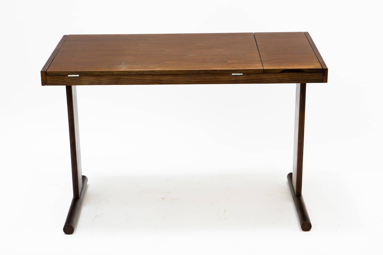 A 1960's Danish style drafting desk/table. Large section for paper and a smaller one for pencils, pens etc. The tops can tilt for drawing.