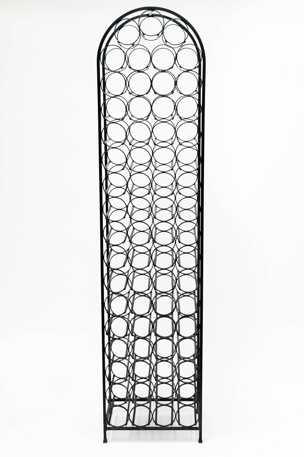 Arthur Umanoff iron wine rack. It holds 67 bottles.