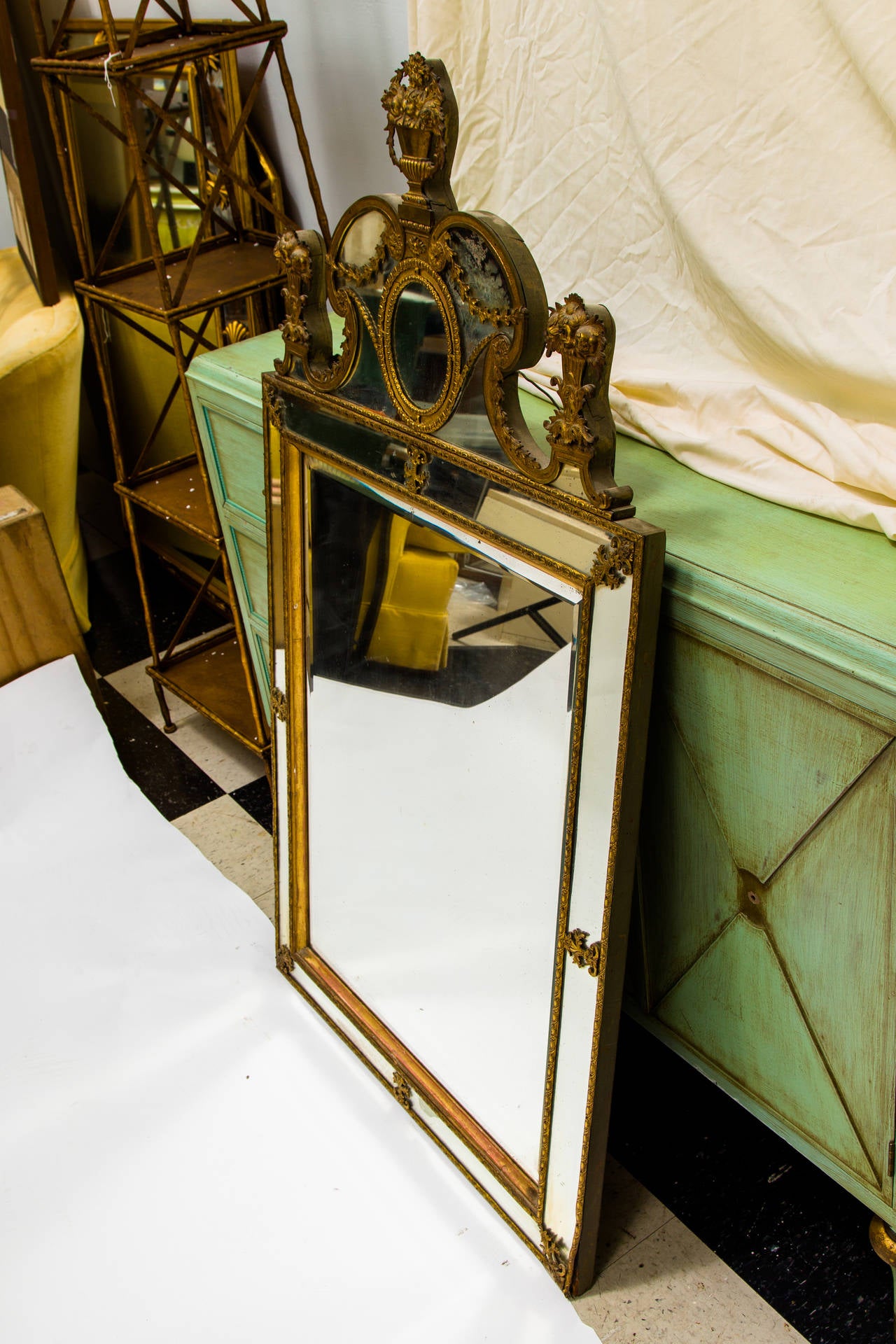 In the Louis XIV style circa 1860 beveled mirror with brass frame.