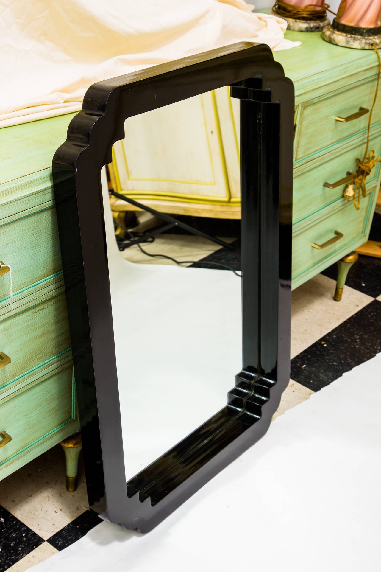 Large Asian style black lacquered wood wall mirror. Thick and heavy wood.