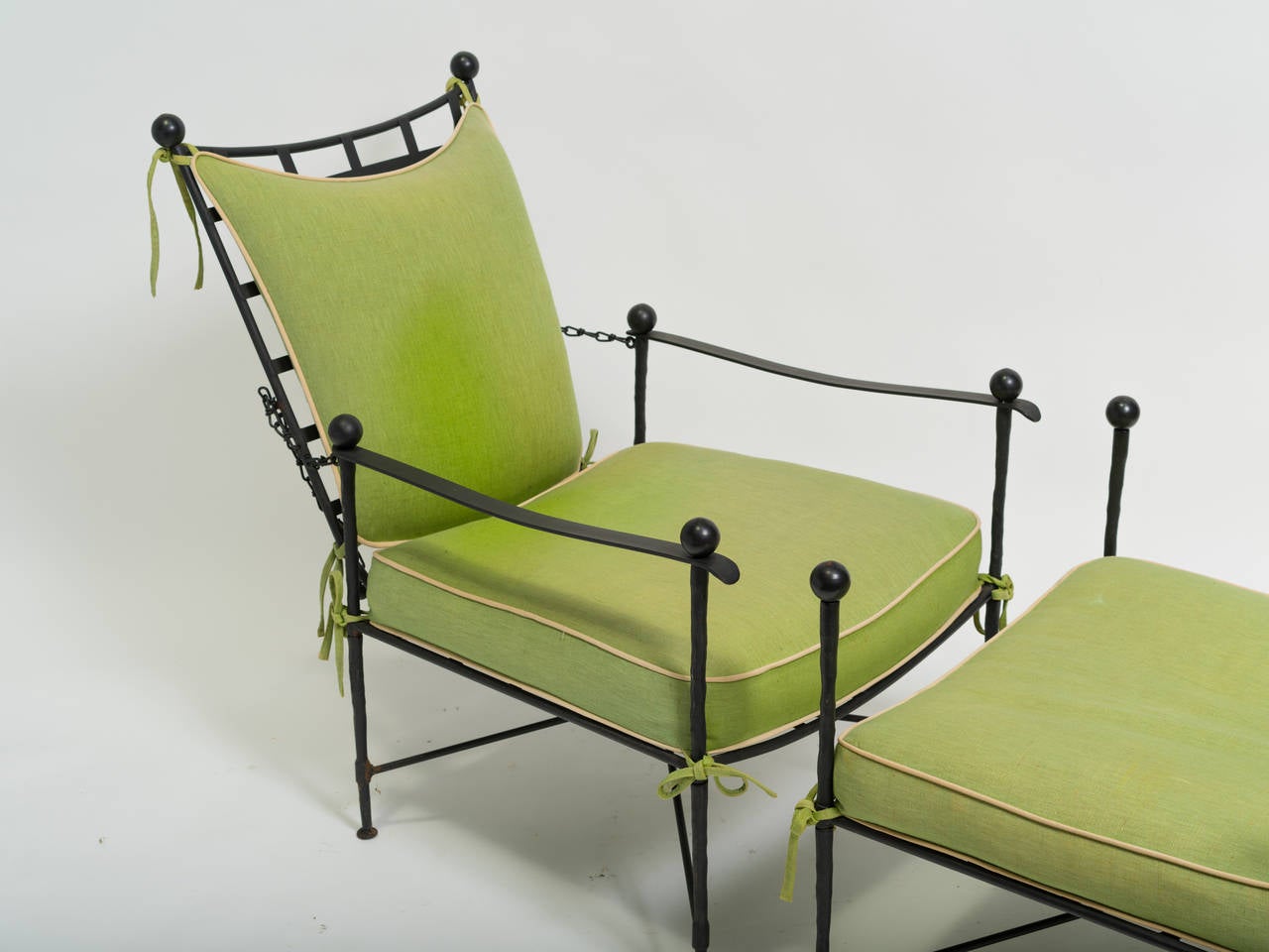 Chic, iron lounge chair with adjustable back and ottoman.