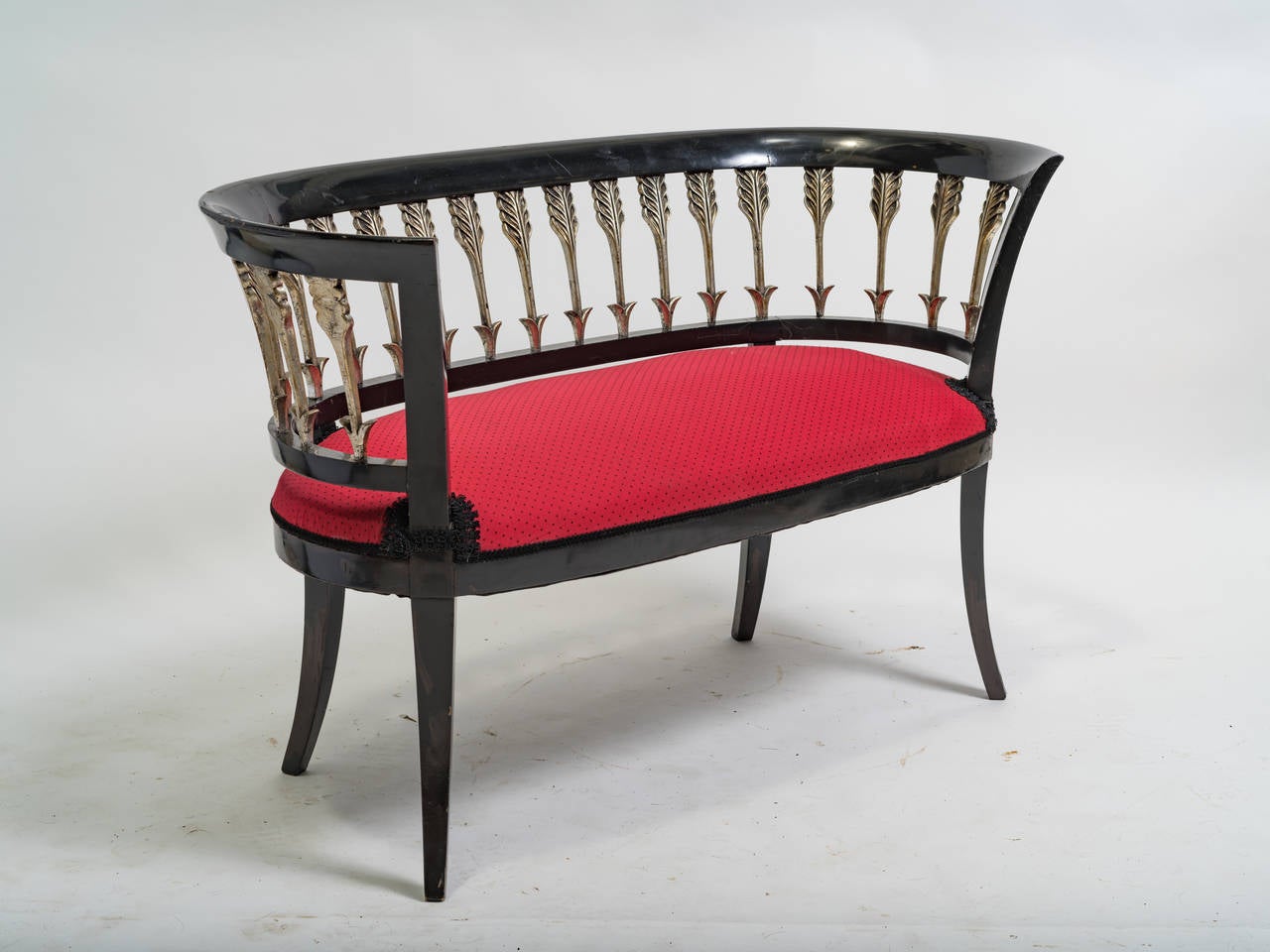 Classical curved lacquered arrow settee.