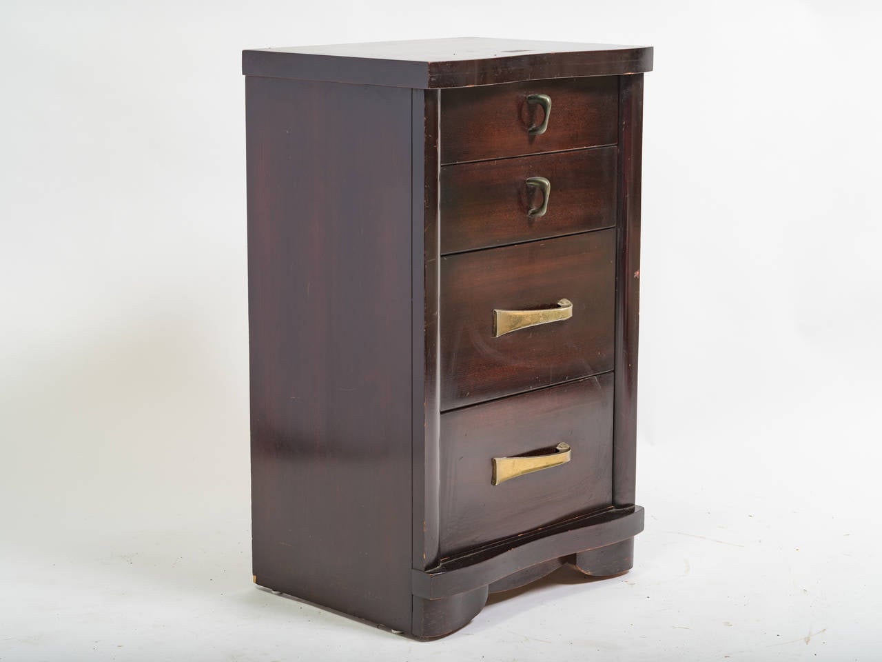 Pair of mahogany night stands. They each have 4 drawers and brass plated pulls.