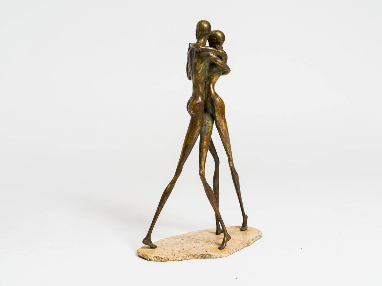Bronze sculpture of a dancing couple standing on a stone base.
No signature.