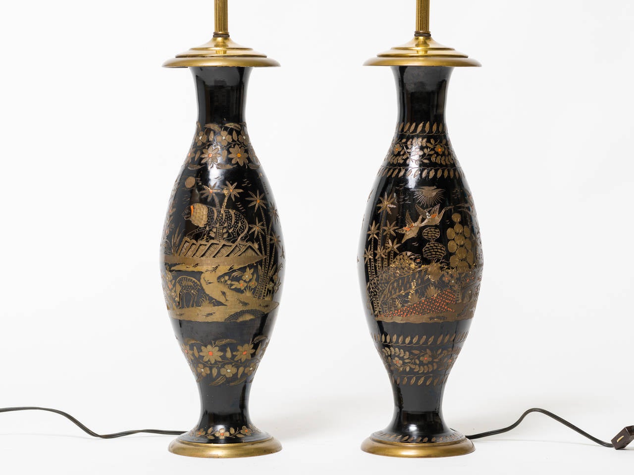 Pair of brass etched Asian motif table lamps.