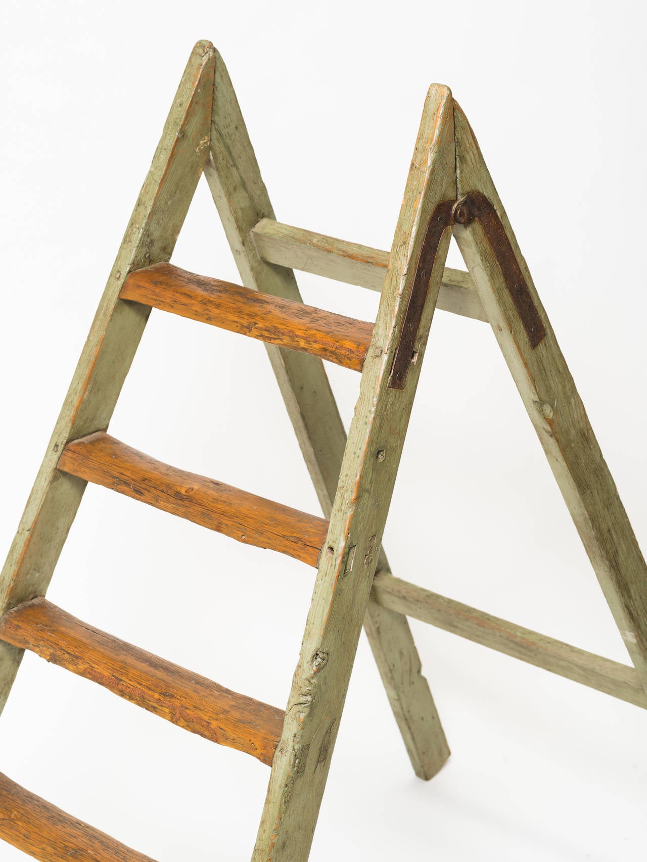 Nice decorative antique looking ladder. Washed green paint, worn look.