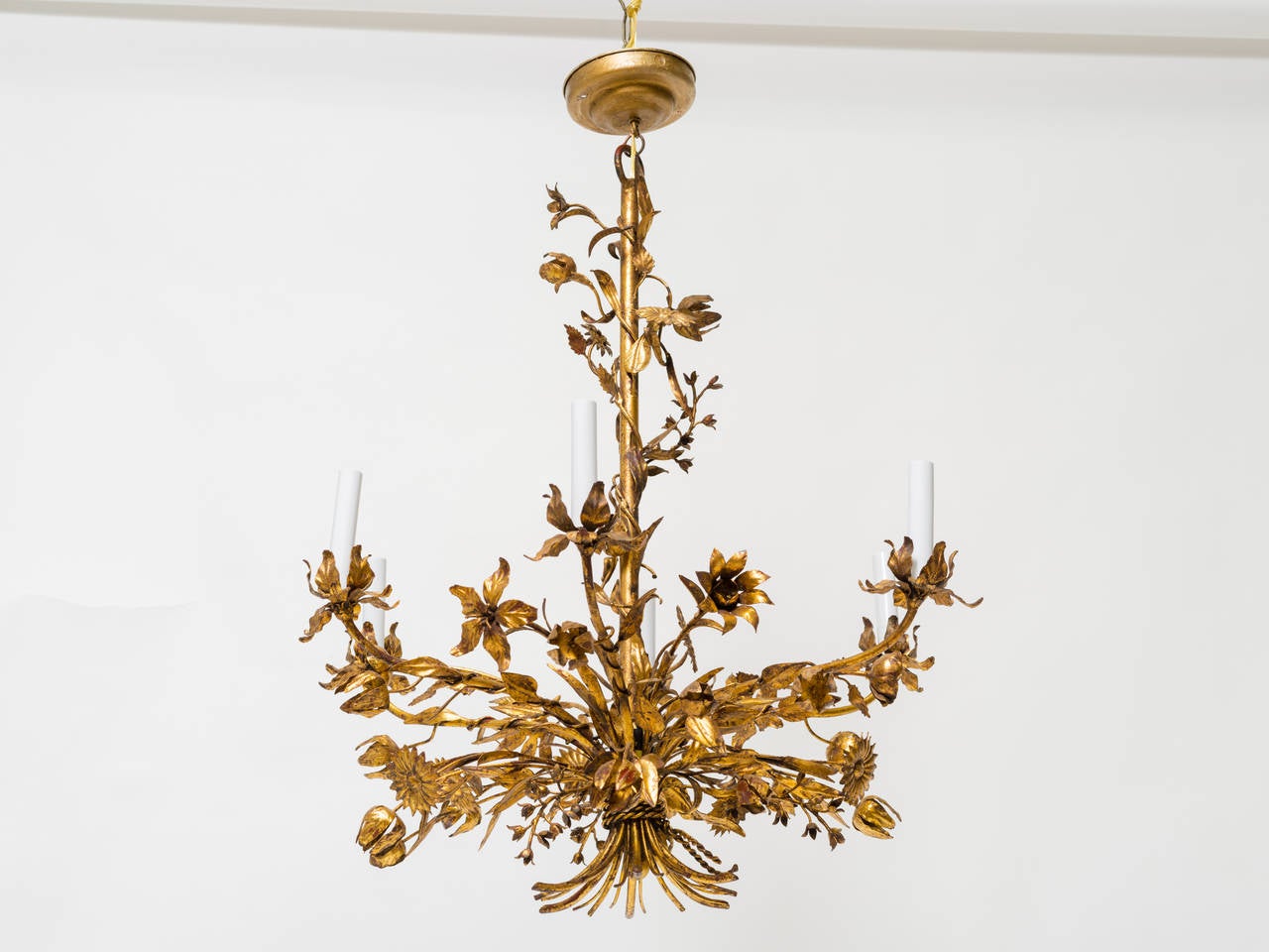 Remarkable 1950's gilt metal chandelier. Great variety of leaves and flowers.
Professionally restored and rewired.