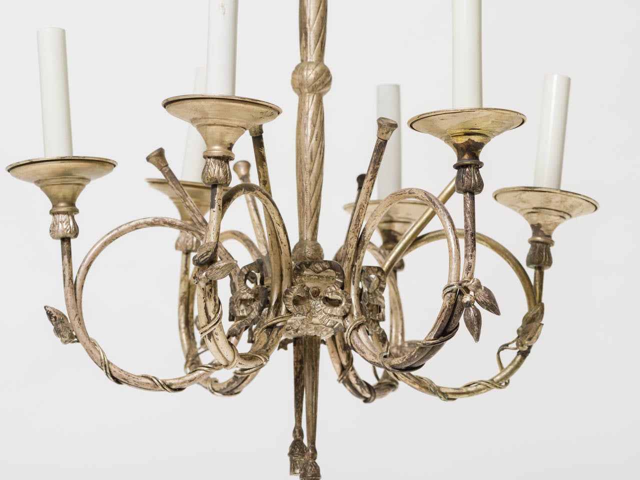 French style six-arm silvered chandelier. It has French horn shaped arms.