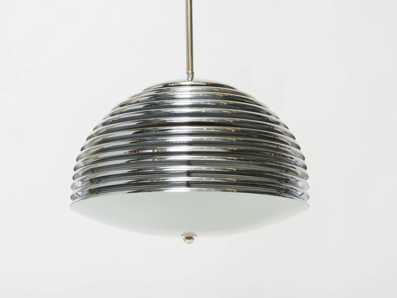 Nickel-plated pendant light composed of overlaid metal disks with frosted convex glass bottom.
Chandelier has been professionally restored and rewired.
Capacity: Three E26 Max 100 watts per socket.