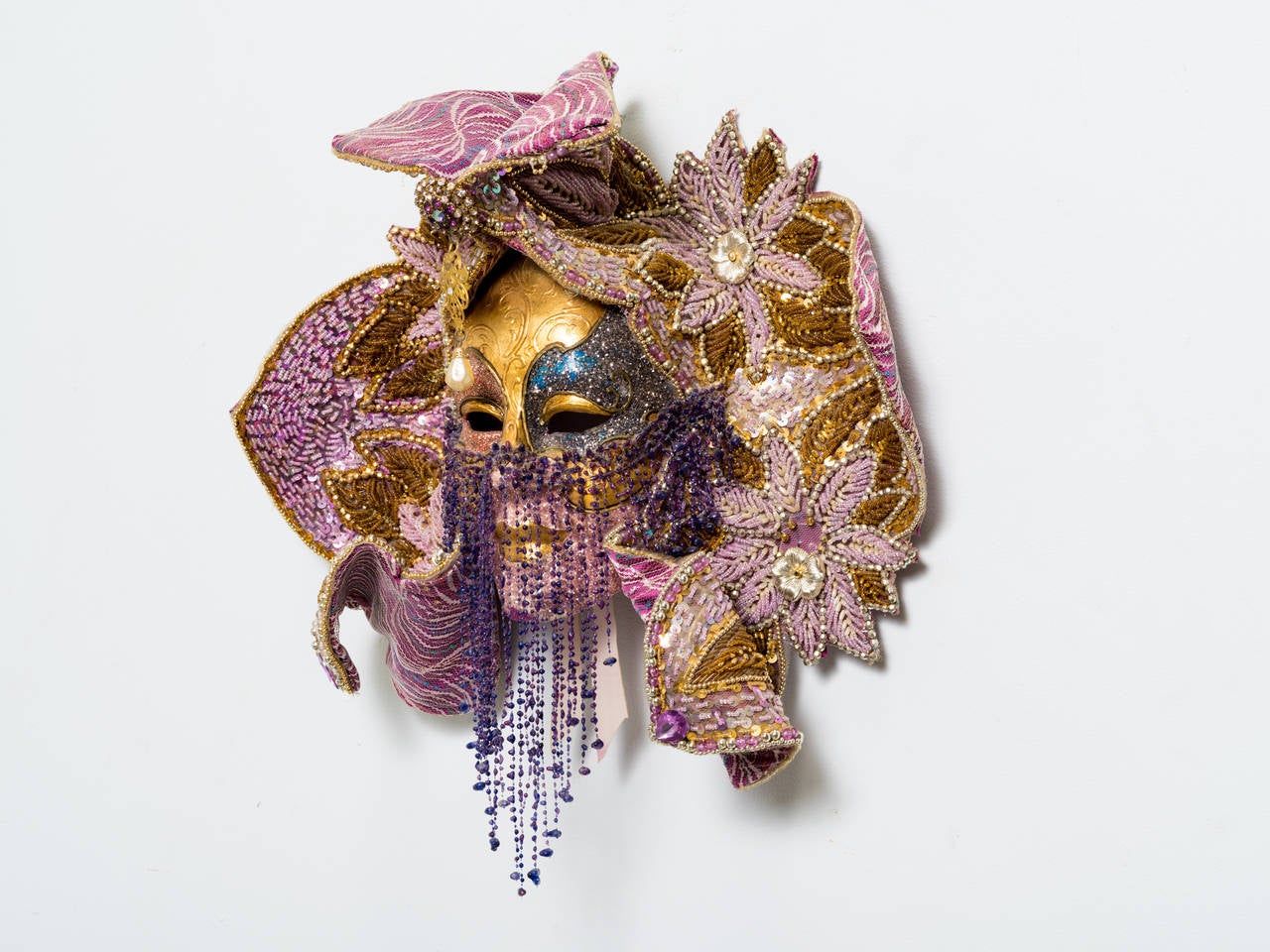 Elaborate carnival masquerade.
Full face composed of sequins, paste stones and others
Signed.