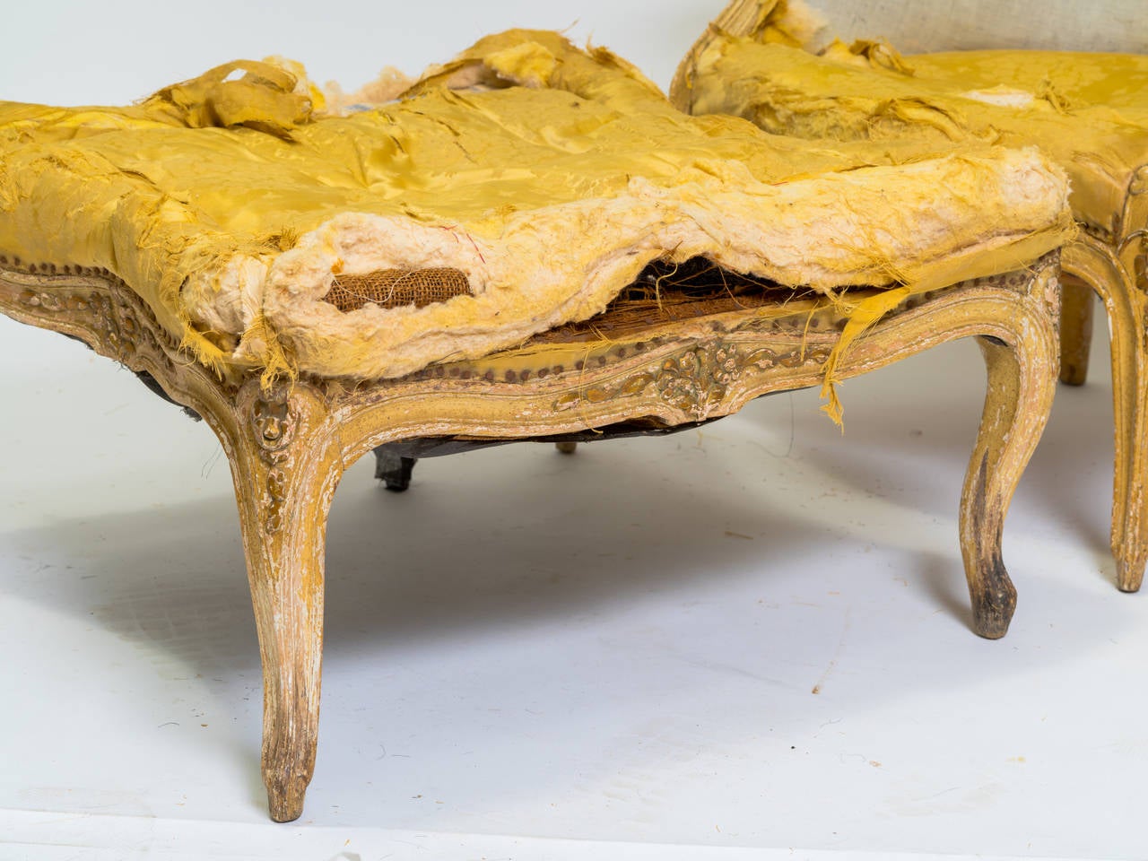 A two-part carved wood chaise, circa 1900