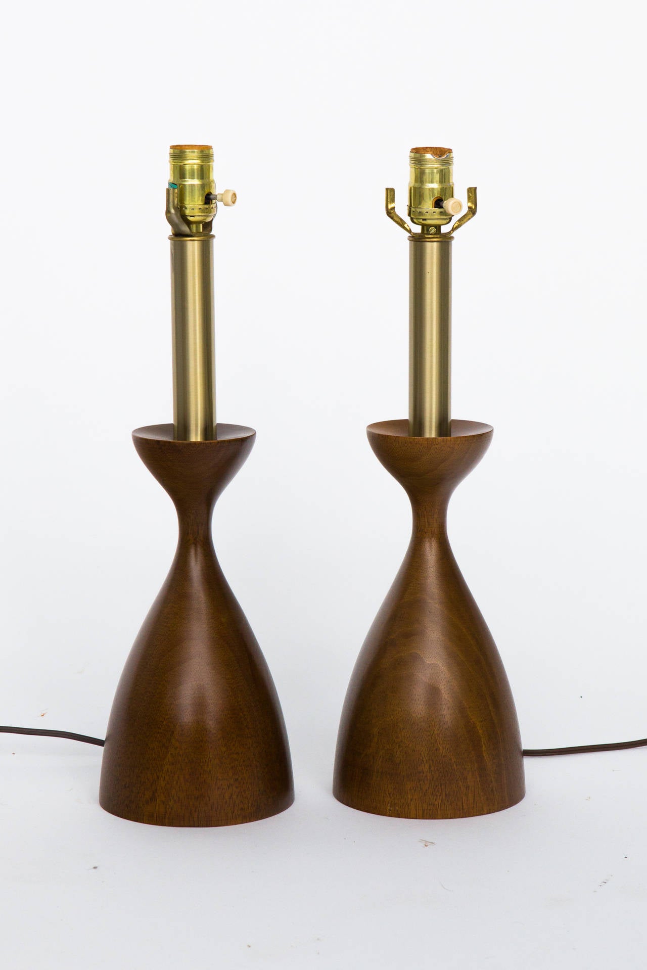 Pair of mid century brass and walnut table lamps by Laurel Lamp Company.