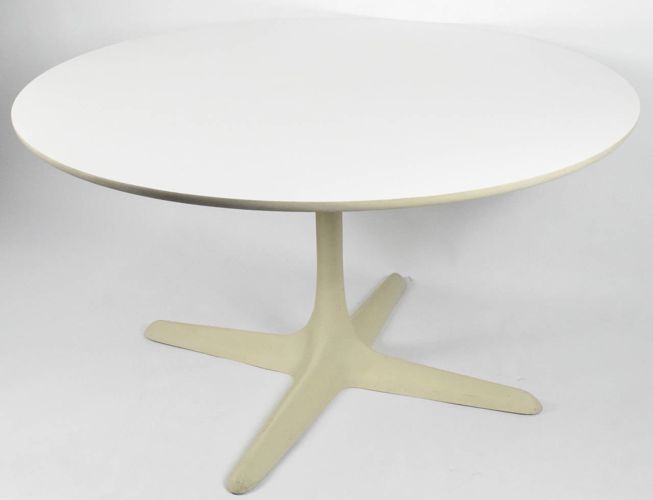 A white laminate top on a fused metal base, Knoll label.