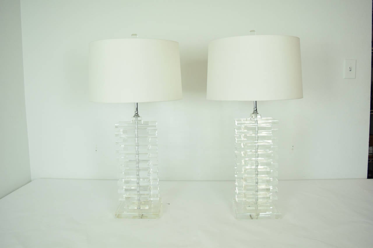Pair of large lucite stacked lamps, very heavy.