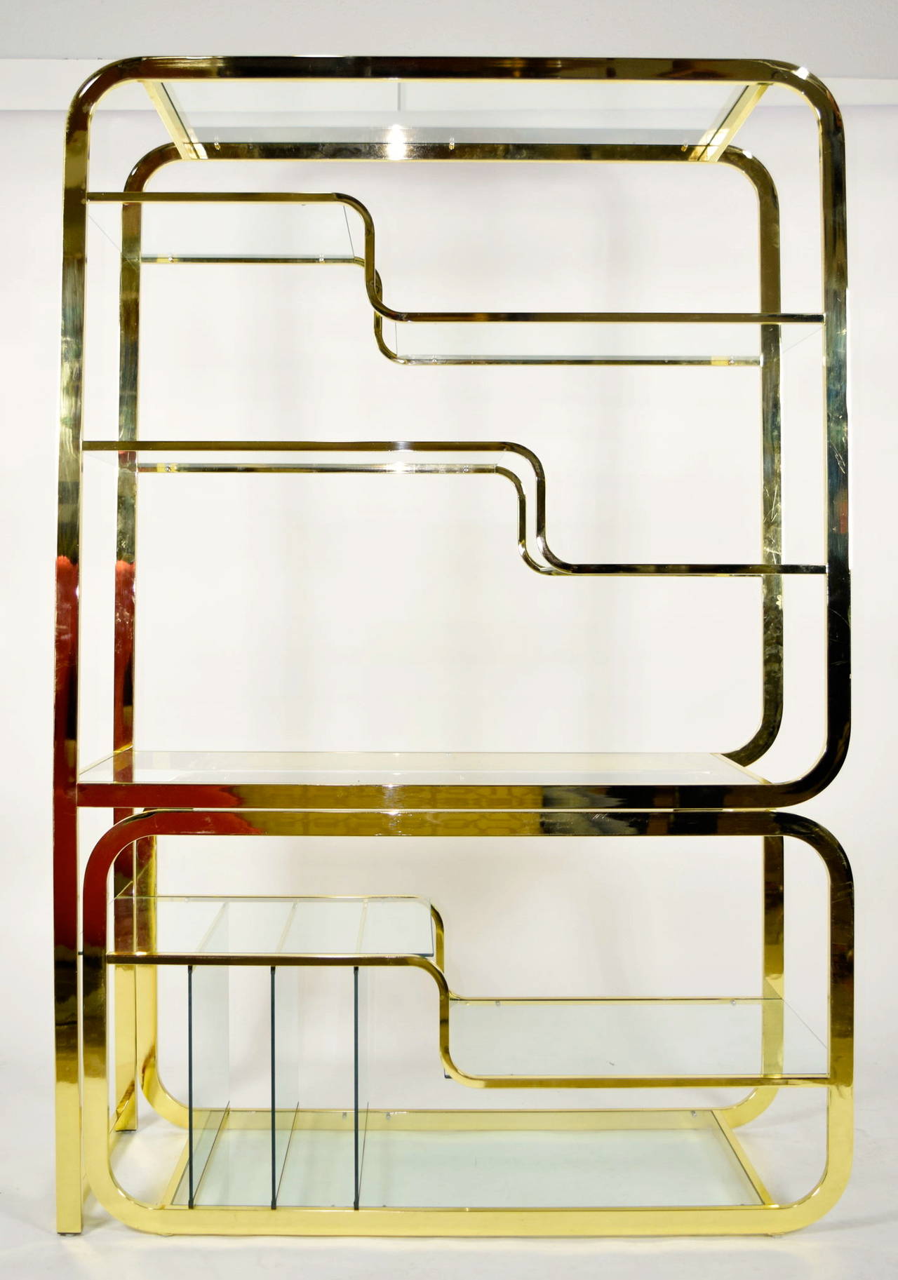 Milo Baughman for DIA brass finish etagere with glass shelves. Bottom extends outward to 87