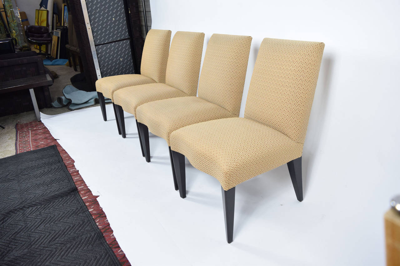 Donghia Serpentine dining chair with dark stained legs. Upholstery is in excellent condition. These are ready to go!