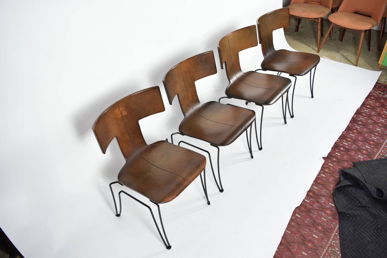 The Anziano chair by John Hutton for Donghia. This set was manufactured in Texas by a highly skilled leather craftsman. Donghia eventually moved production to Italy but the chairs never looked the same. The manufacturer stamped the chair with his