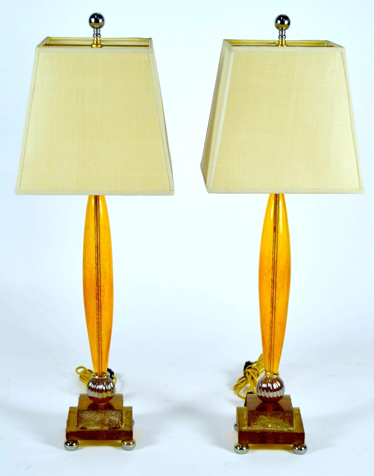 Beautiful pair of Fifi B. Laughlin amber tortoise shell stem lamps with pyramid shades.