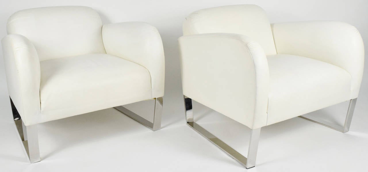 This is a beautiful pair of Donghia's Focal chair in white leather. The leather is very soft and the chair is very comfortable. The chair trade price new is about $3800 in Donghia leather. There is some slight wear to the leather in the back but an