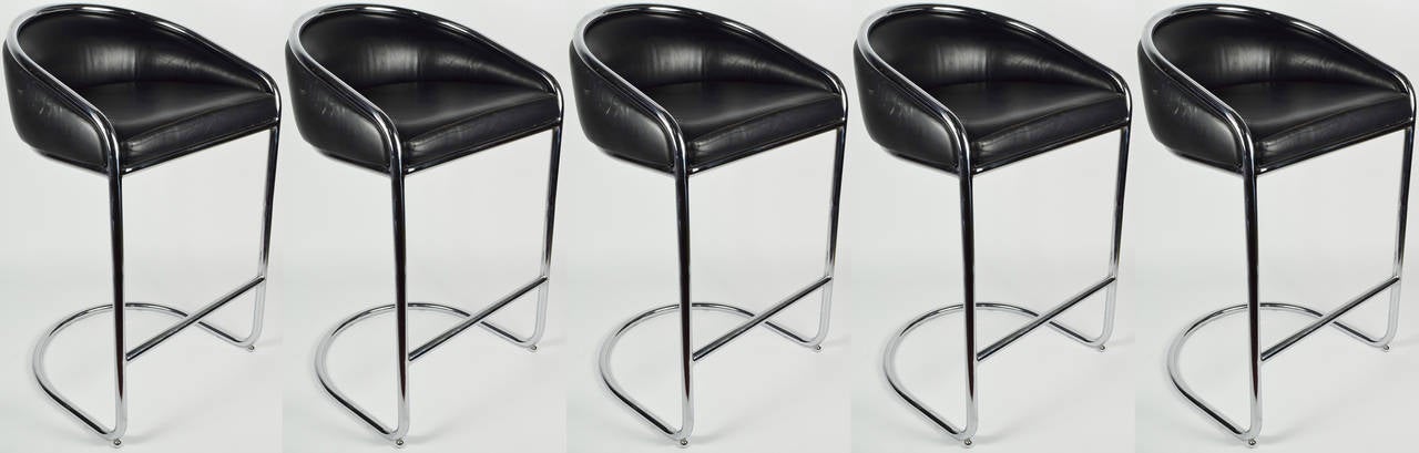 A set of 5 bar stools by Anton Lorenz for Thonet. Chairs are in black leather with a chrome cantilevered frame.
