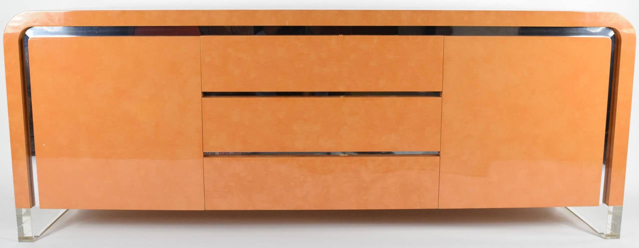 This is a beautiful credenza/sideboard by Vladimir Kagan. It includes 3 drawers and 2 side doors with shelving.
