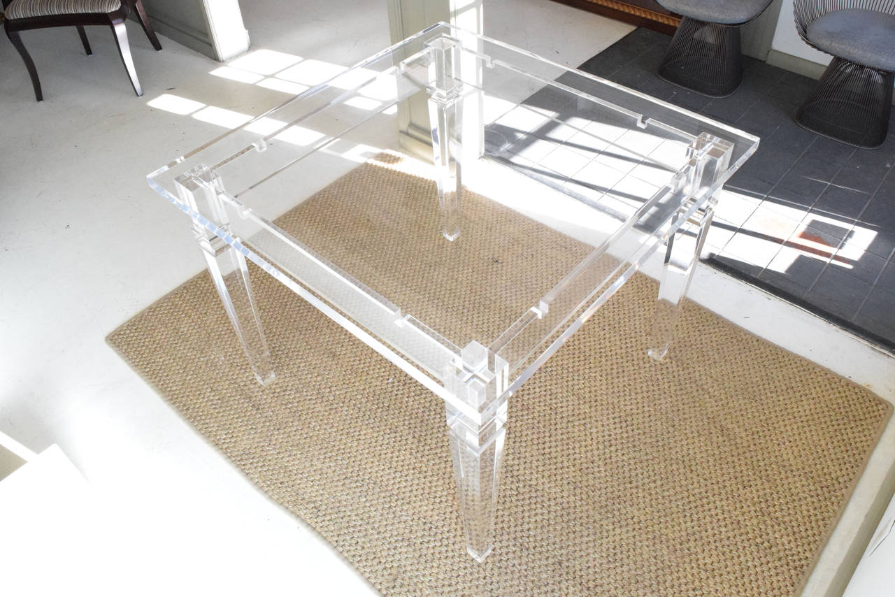 This is a beautiful acrylic table with tapered legs, very thick top, in pristine condition.