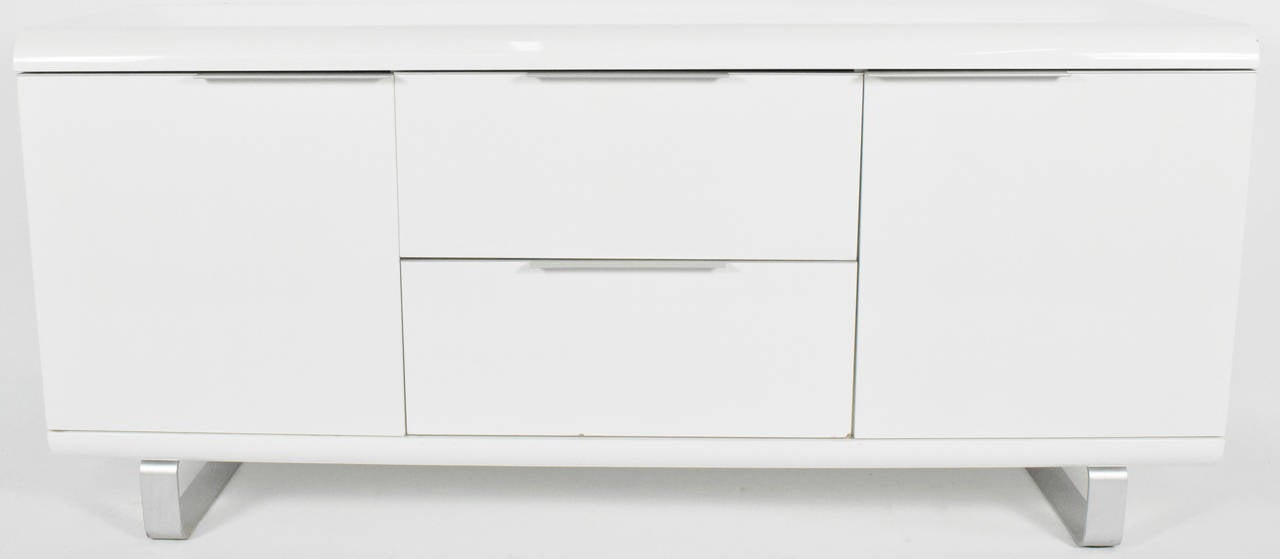 A very nice sideboard or credenza by Saporiti in white lacquer with chrome legs.