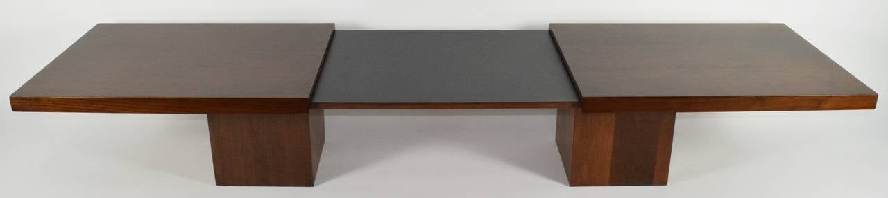 A John Keal designed extendable coffee table, extended measurement 95.25