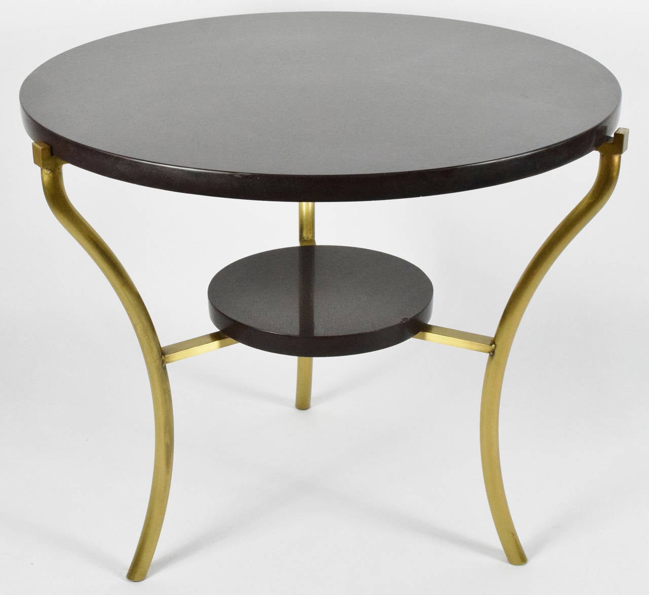 The table has a black caesarstone top and shelf with antique brass finish on metal legs, table weighs 175 lbs!