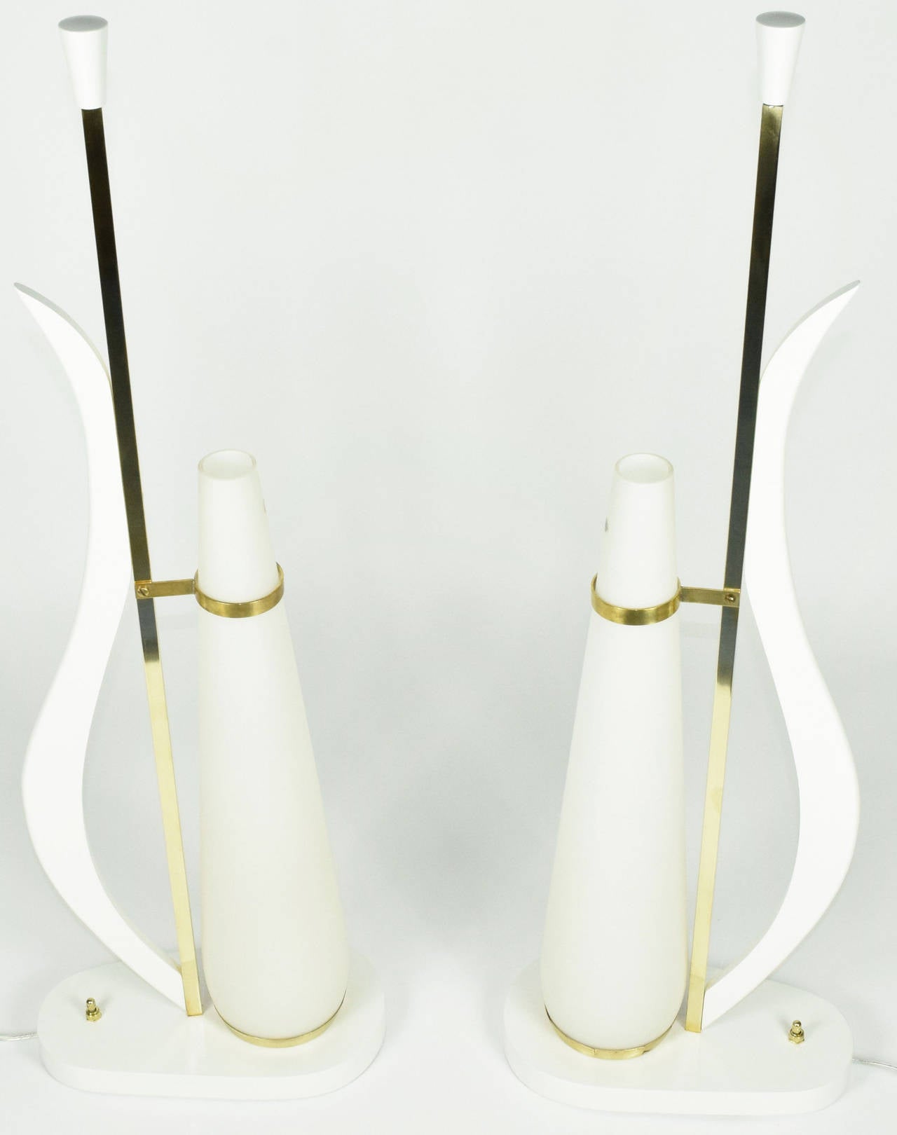 This is a special pair of Italian glass table lamps. The lamps have been completely restored in a white finish and are in beautiful condition. Glass is original Murano in opaque white.