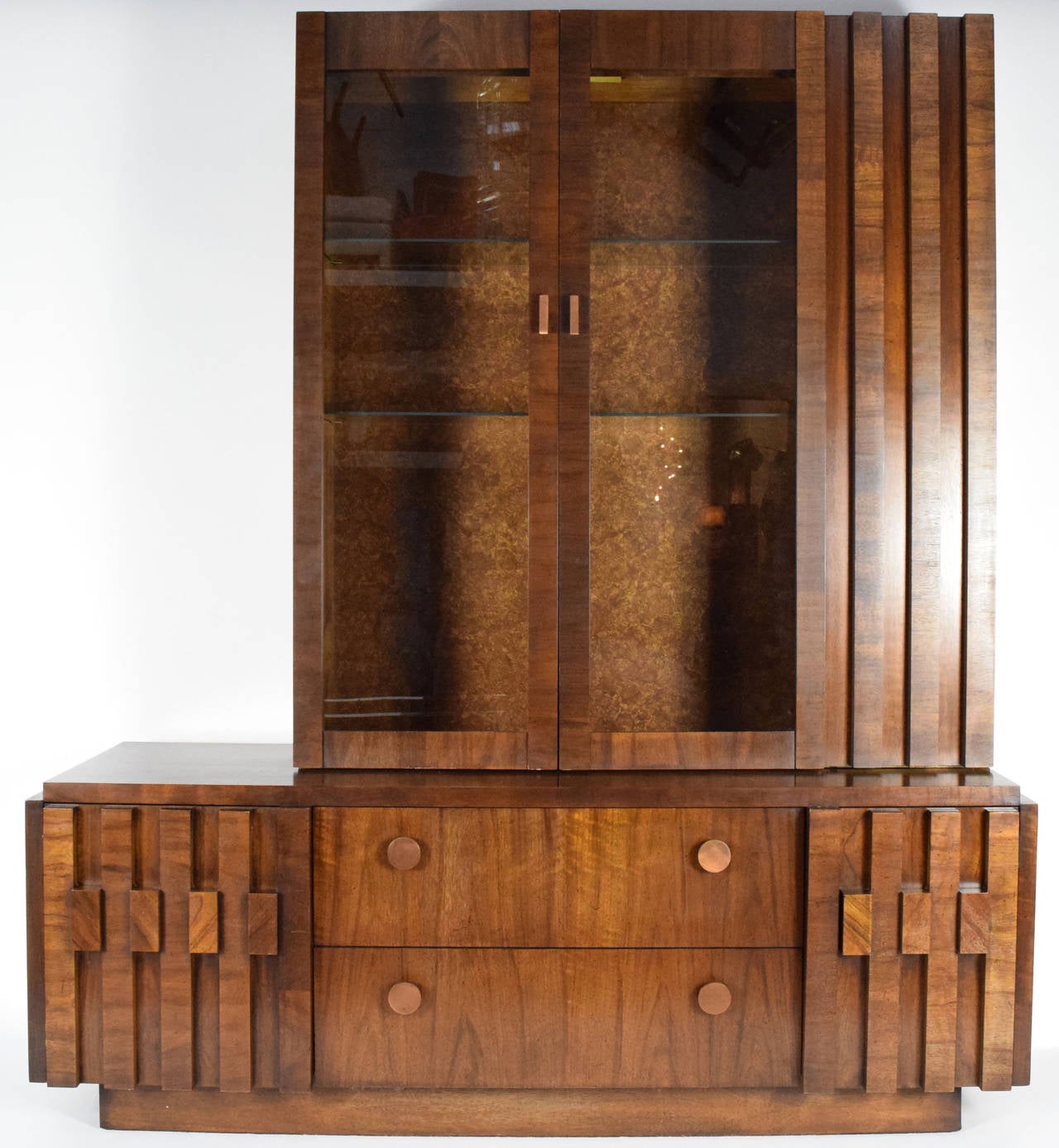 Beautiful Lane cabinet with hutch, part of their Mosaic series. Two glass display shelves in top and two drawers with two cabinets in bottom unit. Has interior lighting.