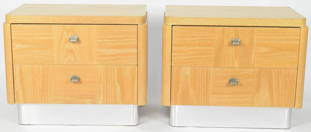 This is a very nice pair of nights stands or side tables with chrome bases and a limed oak finish by Rogier