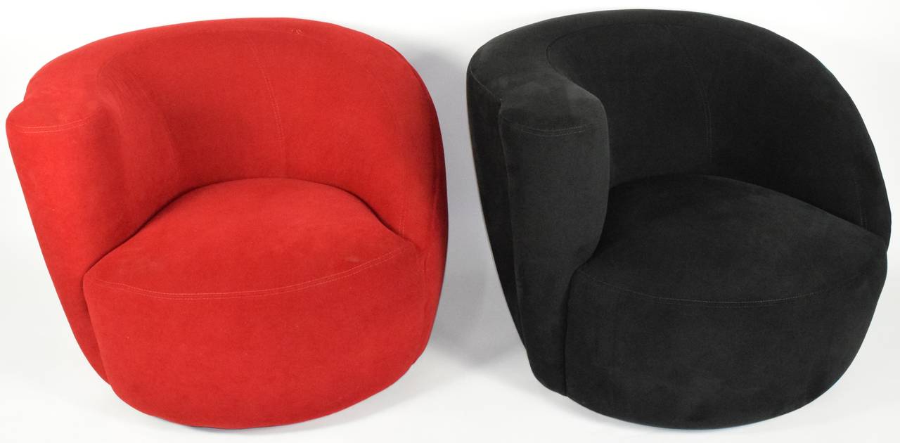 Nautilus Chair designed by Vladimir Kagan for Directional. The lounge chairs sit on a swivel base, which allows them to rotate 180 degrees and then return to their original position.