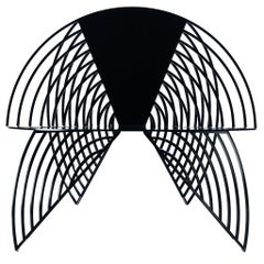 Silla escultórica Wings of Steel, diseñada por Laurie Beckerman en 2012