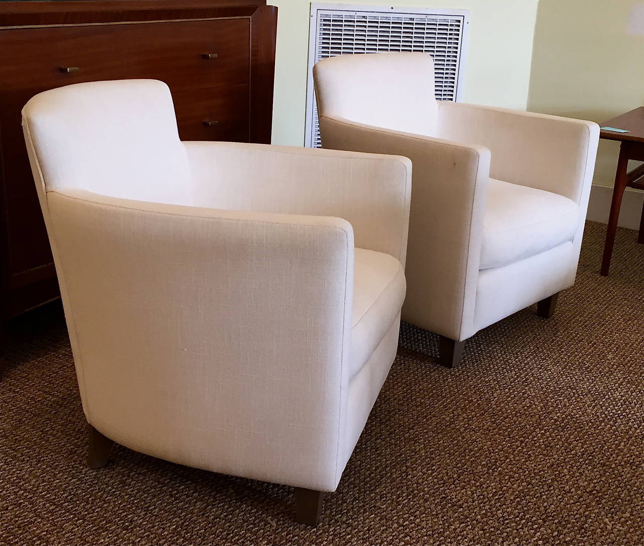These Art Deco style club chairs have a compact footprint but are wonderfully comfortable. Inspired by 1940s French deco masters, such as Dominique, they are upholstered in linen and ready to accept another fabric or be enjoyed as is.
