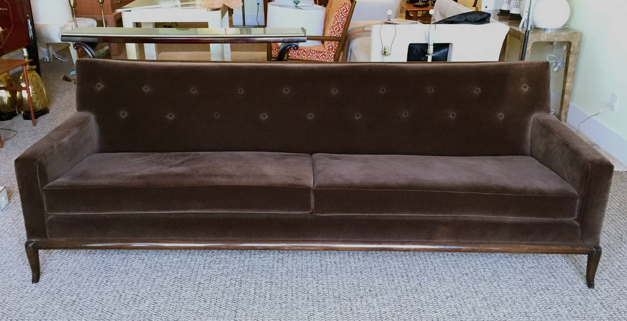 This button back sofa has a wooden base and framed back with a gracefully flared leg.  It is from the estate of Leo Steinberg, one of the most influential art historians of the past sixty years.

Please contact us directly for shipping options.