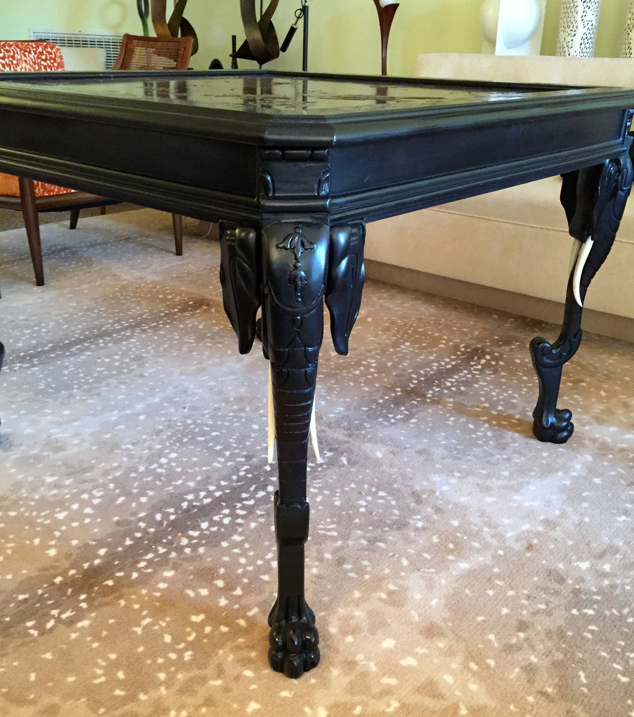 Carved Eclectic Center Table with Elephant-Form Legs and High Relief Decorated Top For Sale
