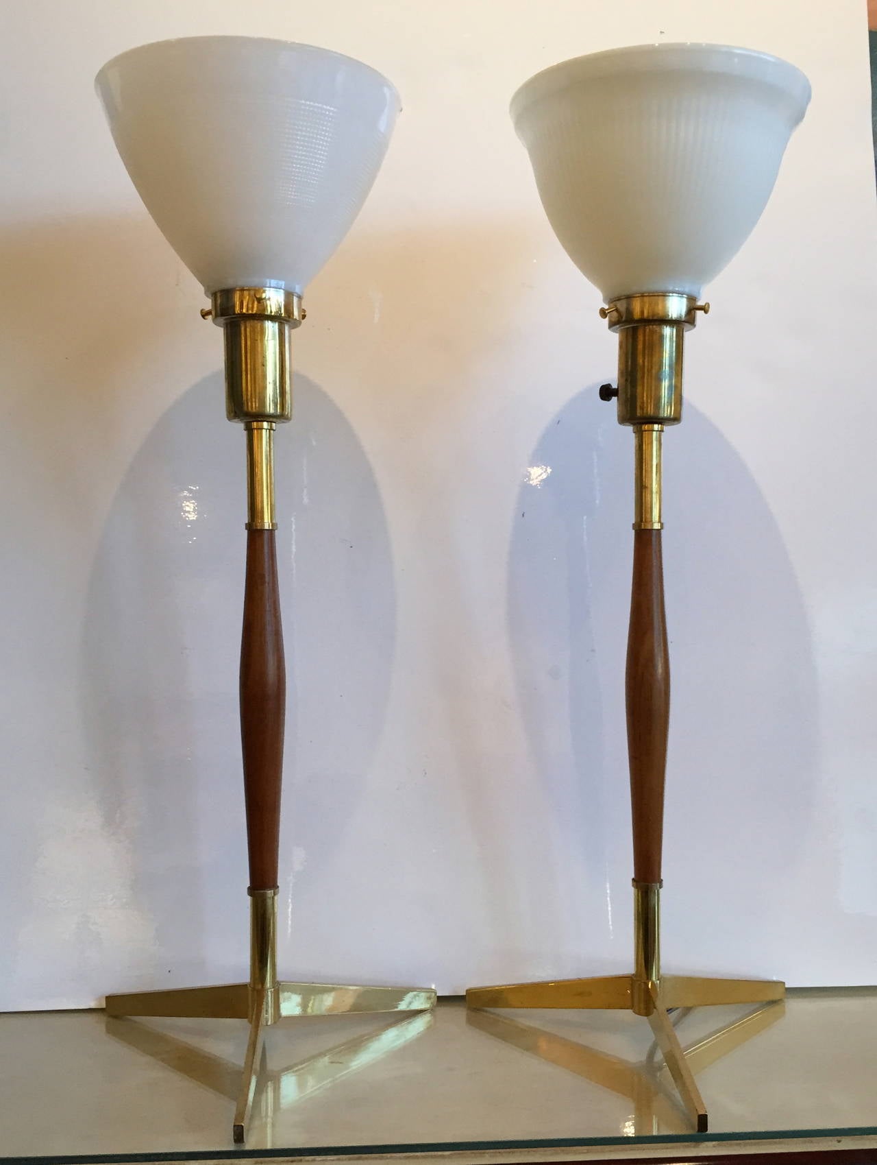 These sleek lamps are 25.5 inches high to the top of the diffusor.  The body of the lamp is 17 inches high.  The diffusors are included; the shades are not.

Please contact us directly for shipping options.