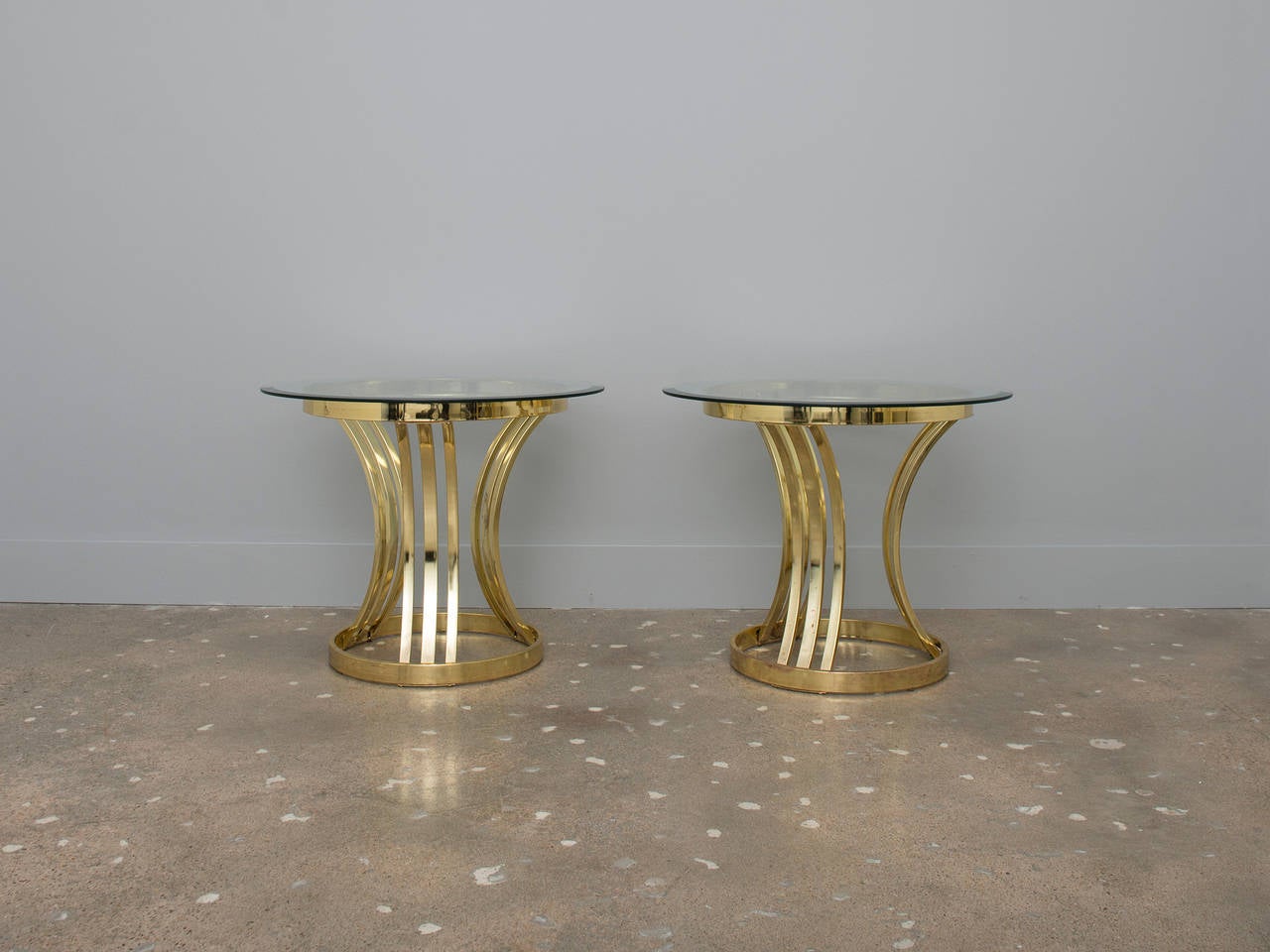 Hollywood Regency brass end tables in good vintage condition.