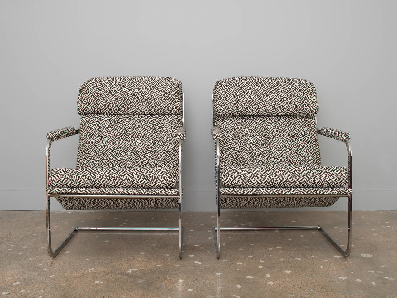 Cantilevered scoop chrome chairs by Carsons of High Point recently upholstered in Knoll Eclat fabric.