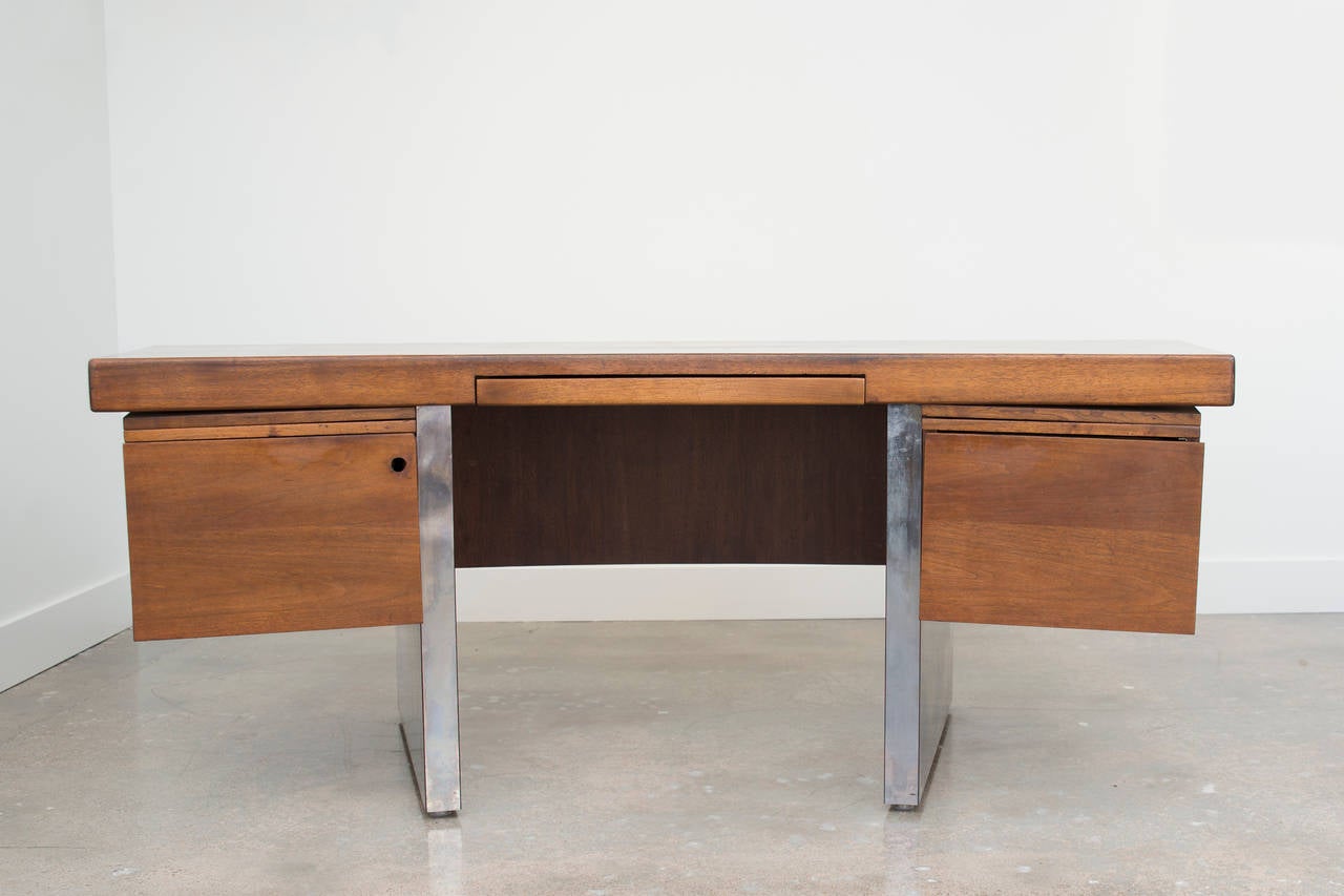 Roger Sprunger Mid Century Modern curved walnut and chrome executive desk.